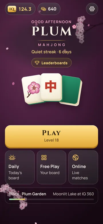 The home screen in Plum Garden, with Player IQ, a streak, the Play button, and Daily, Free Play and Online below.